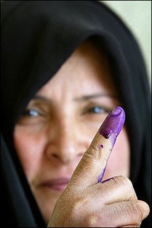 woman showing finger after iraq vote
